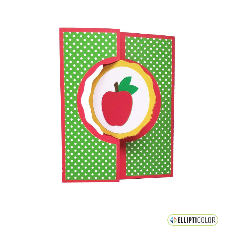 Card with a red apple design on a green polka dot background