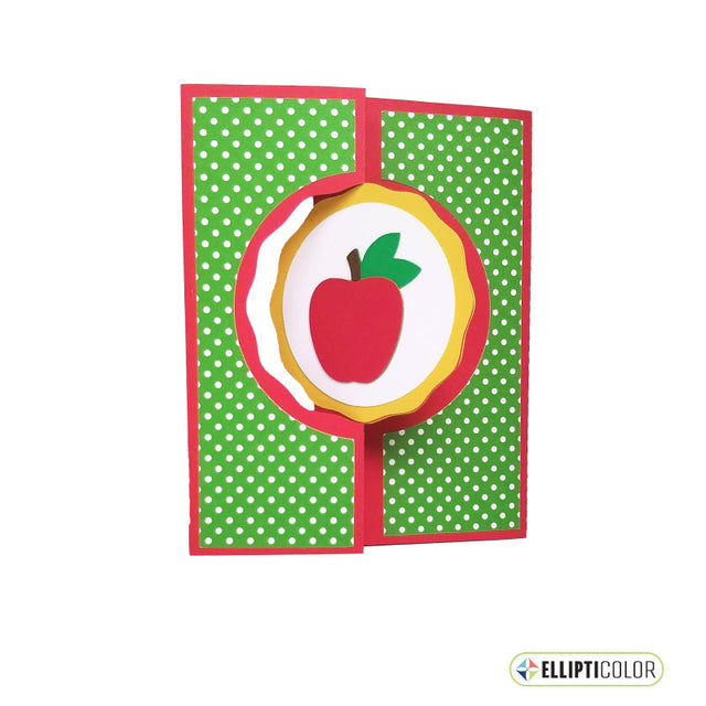 Card with a red apple design on a green polka dot background