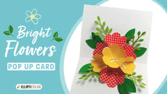 Pop-up card with red and yellow flowers on a blue background