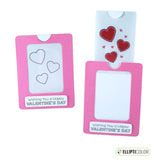 Magic slider card with a Valentine message and a pink frame around hearts that are black and white before the tab is pulled and colorful after