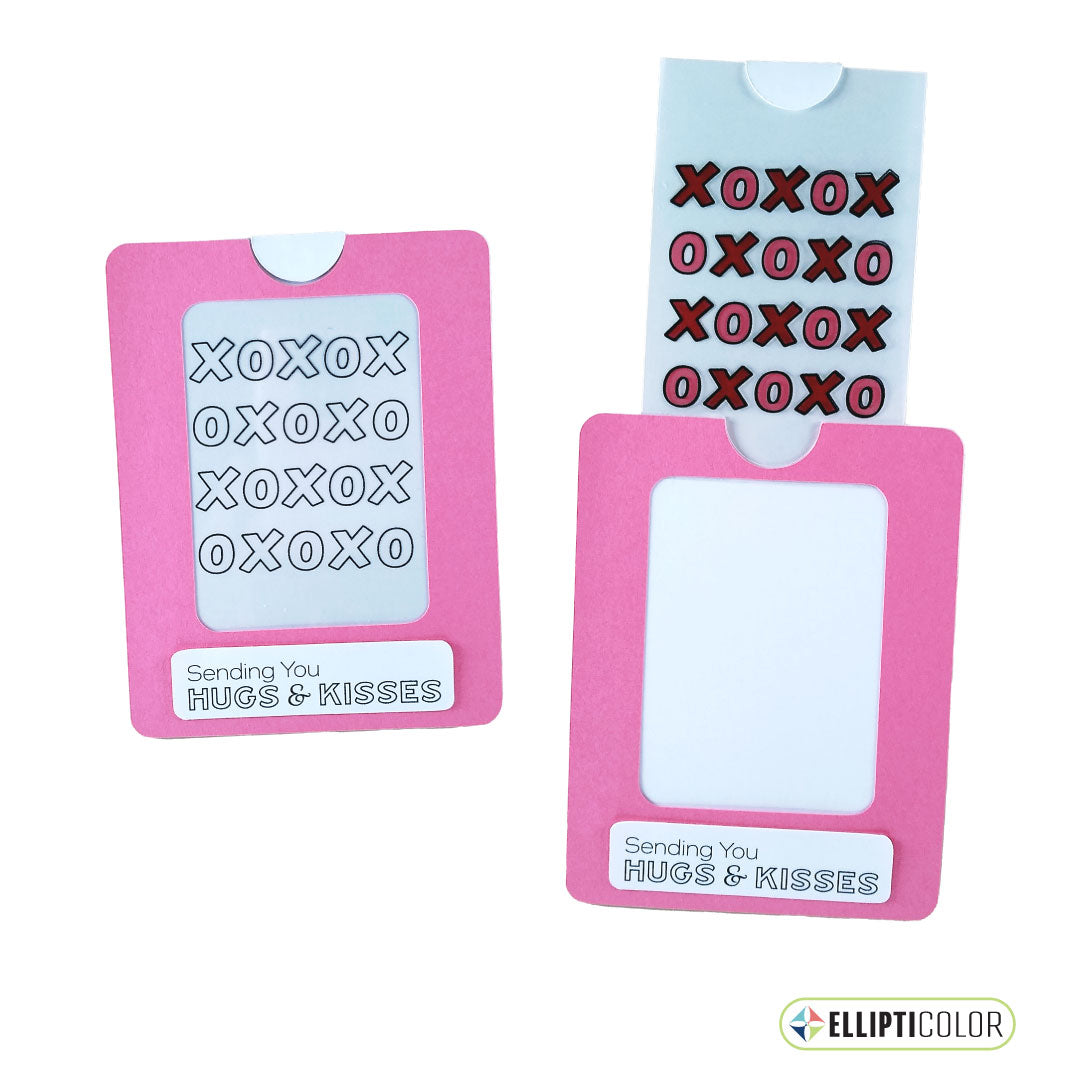 Magic slider card with a hugs & kisses message and a pink frame around and XOXO design that is black and white before the tab is pulled and colorful after