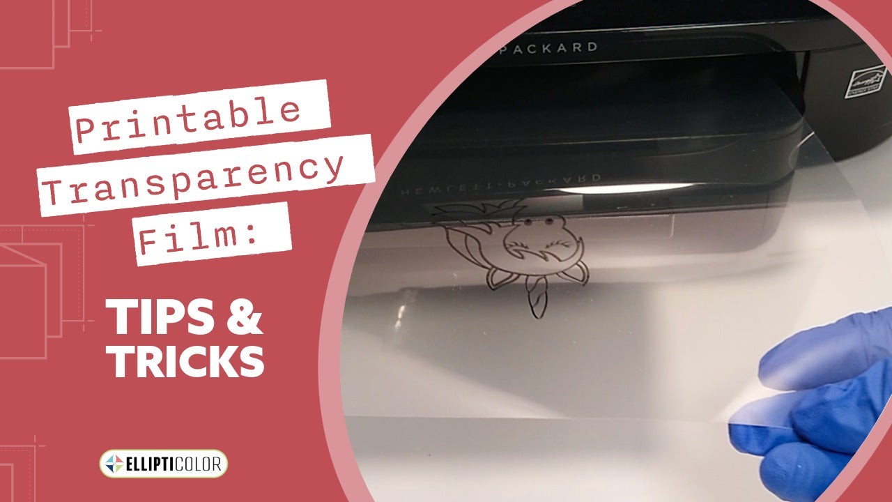 Hand removing printable transparency film from a printer with text, 'Printable Transparency Film: Tips and Tricks'
